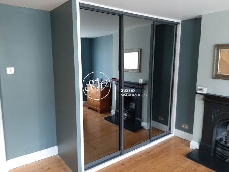 Fitted Wardrobe with Anthracite Frame and Grey Mirror Doors.