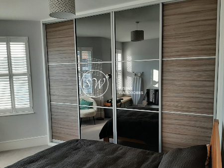 Three Panel Mirror and Woodgrain Doors Fitted Wardrobe